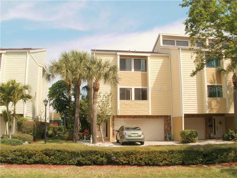 460 Sandy Hook Road, Unit 460 Treasure Island, FL 33706 - Photo 1 of 1 Exterior Front - Front of Town Home Corner Unit 2 car parking pad 2 car garage.