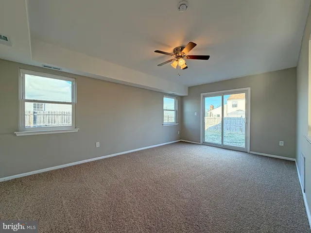 a view of empty room with windows