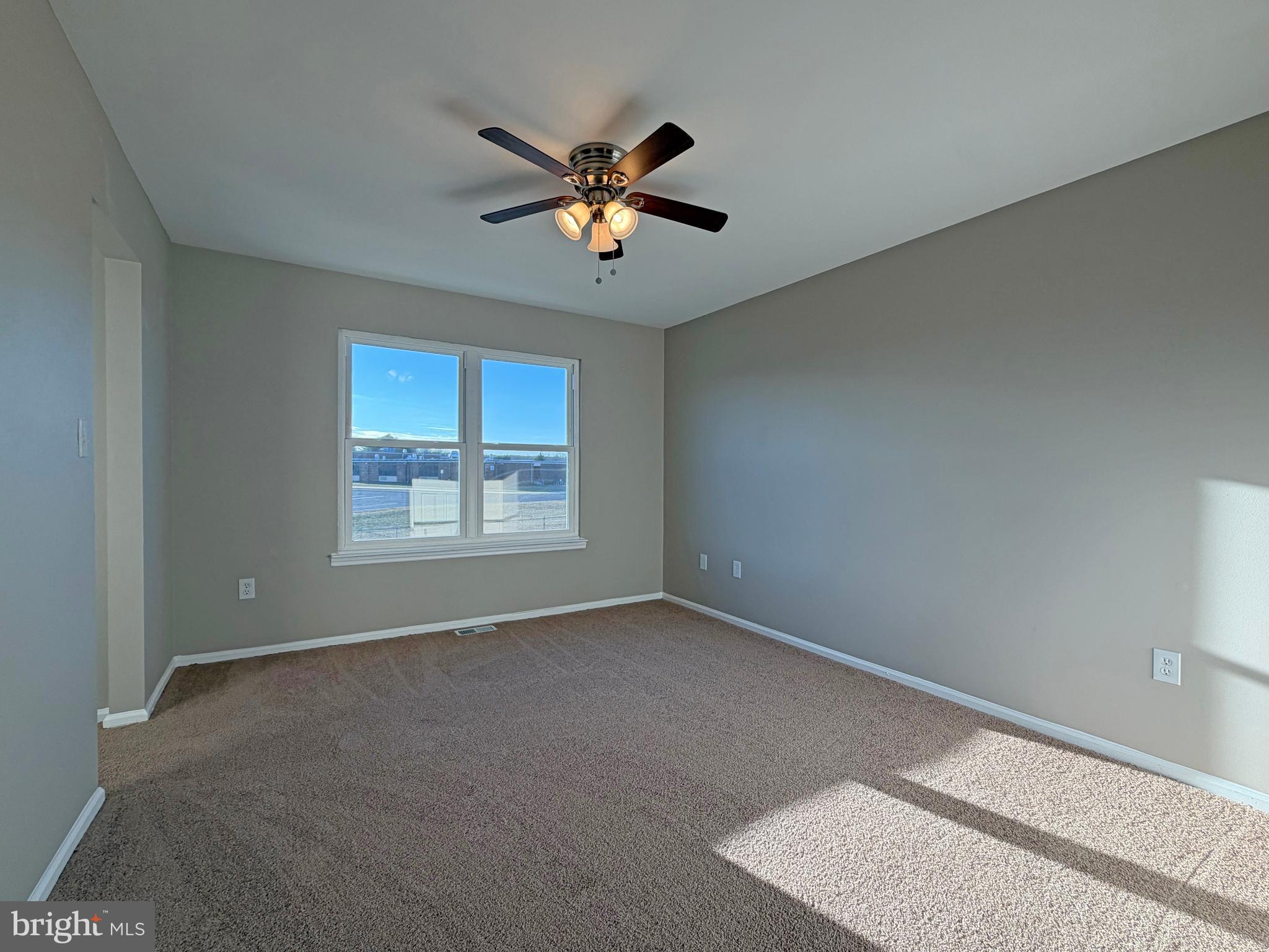 79 Scenic View Drive Sicklerville, NJ 08081 - Photo 8 of 11 a view of a livingroom with a ceiling fan and window