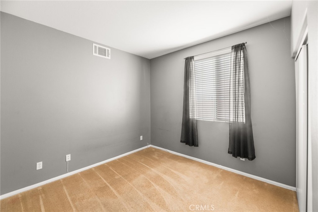 1339 Addison Way Perris, CA 92571 - Photo 22 of 67 a view of an empty room with a window