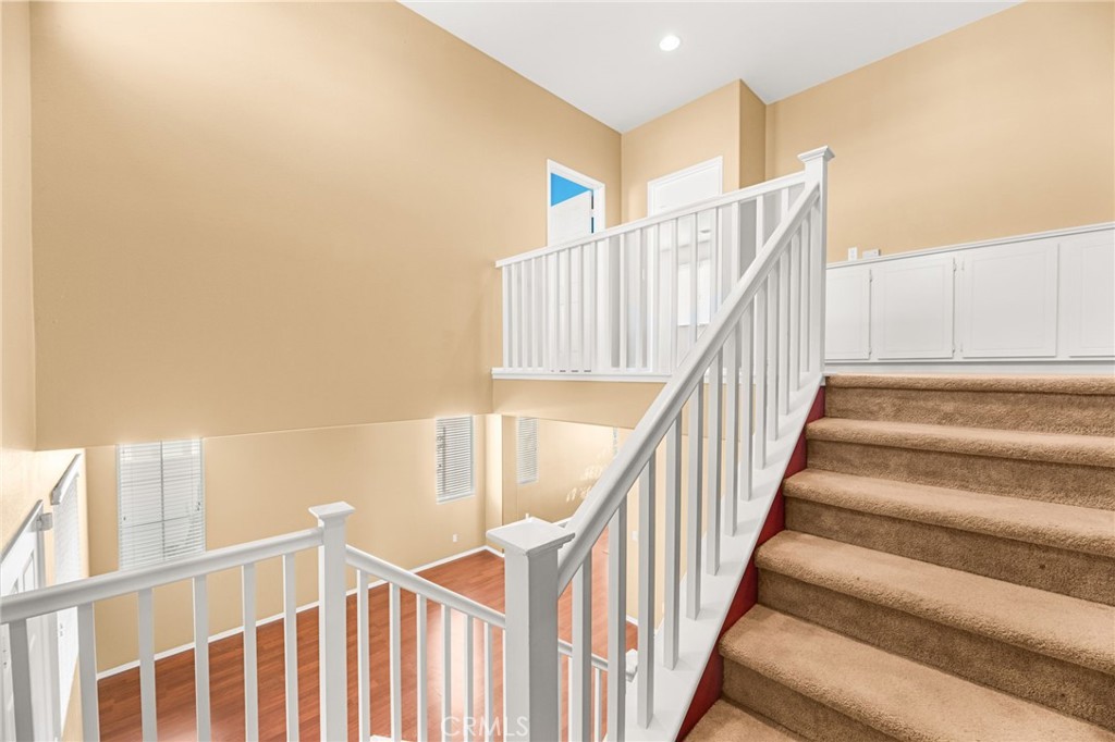 1339 Addison Way Perris, CA 92571 - Photo 24 of 67 a view of staircase with railing and white walls