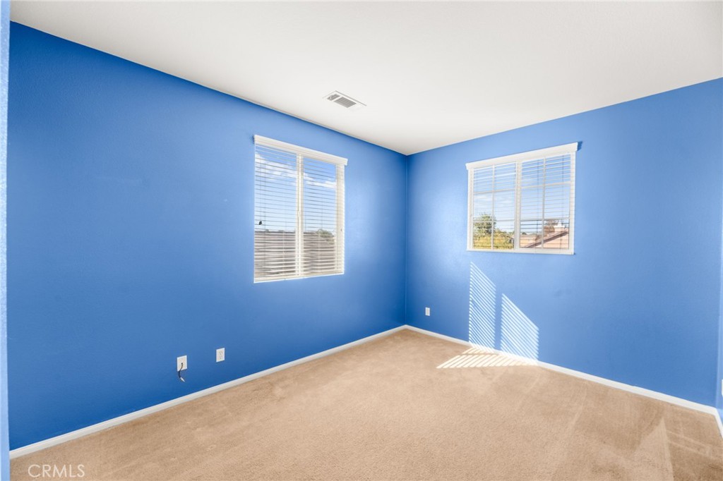 1339 Addison Way Perris, CA 92571 - Photo 28 of 67 a view of an empty room with a window