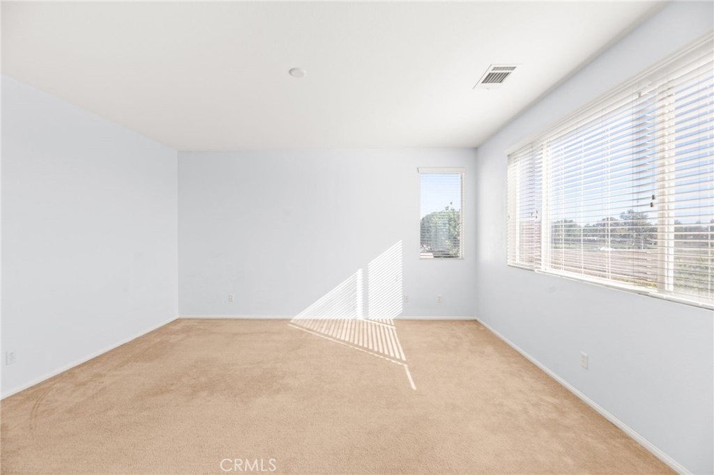 1339 Addison Way Perris, CA 92571 - Photo 32 of 67 an empty room with windows