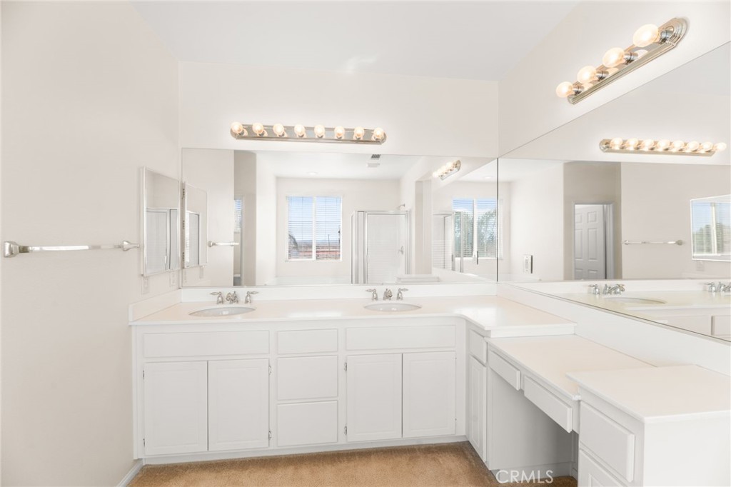 1339 Addison Way Perris, CA 92571 - Photo 34 of 67 a spacious bathroom with a double vanity sink mirror and
