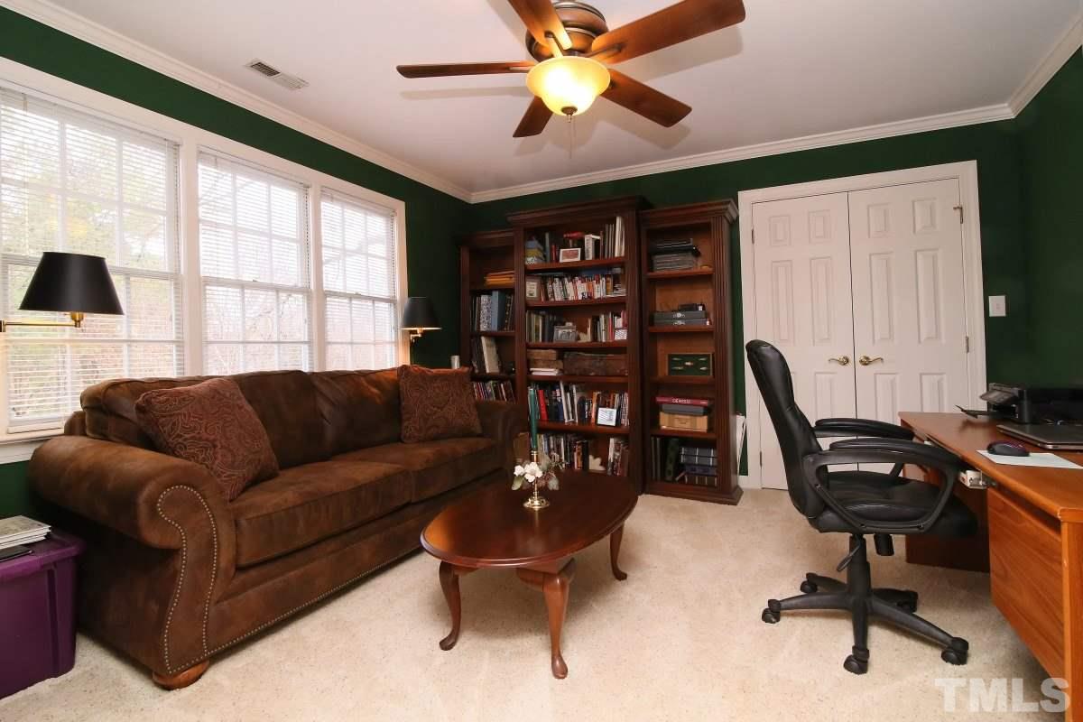 2908 Ballybunion Way Raleigh, NC 27613 - Photo 14 of 25 a view of a livingroom with workspace and a window