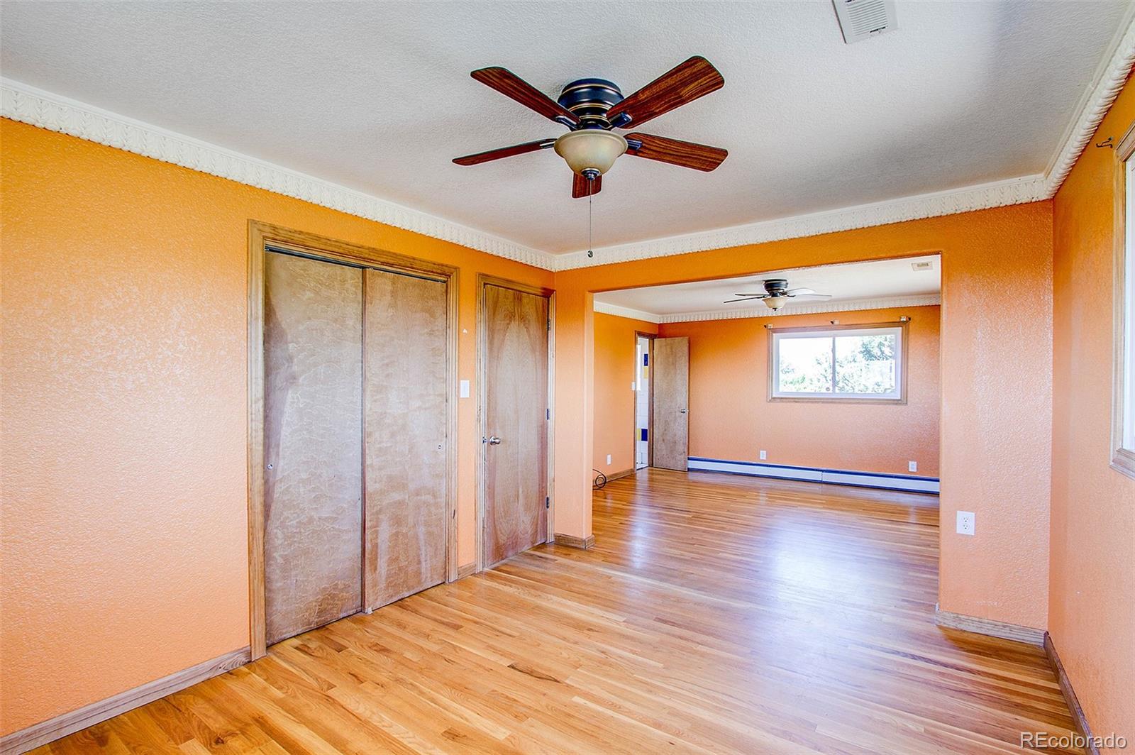 5475 Meridian Road Peyton, CO 80831 - Photo 20 of 35 a view of empty room with wooden floor