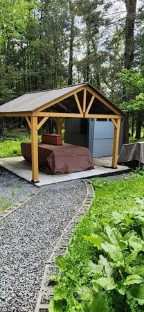 a bedroom with a bed and painting on the wall