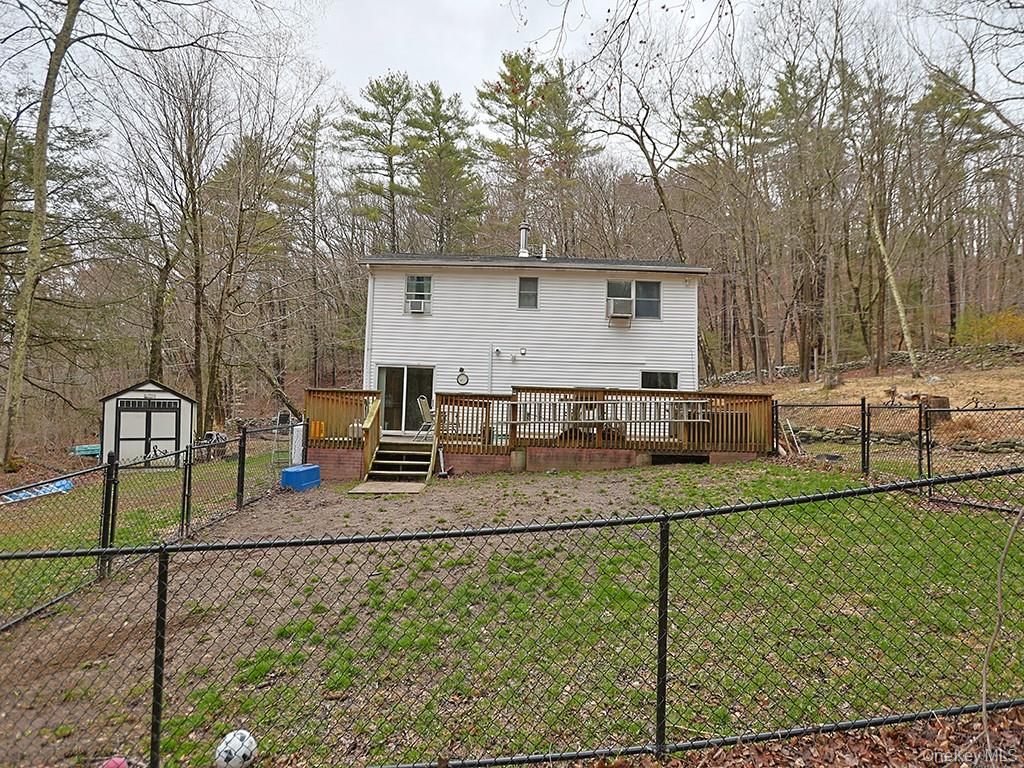 68 Kennel Road Cuddebackville, NY 12729 - Photo 5 of 21 a backyard of a house with barbeque oven