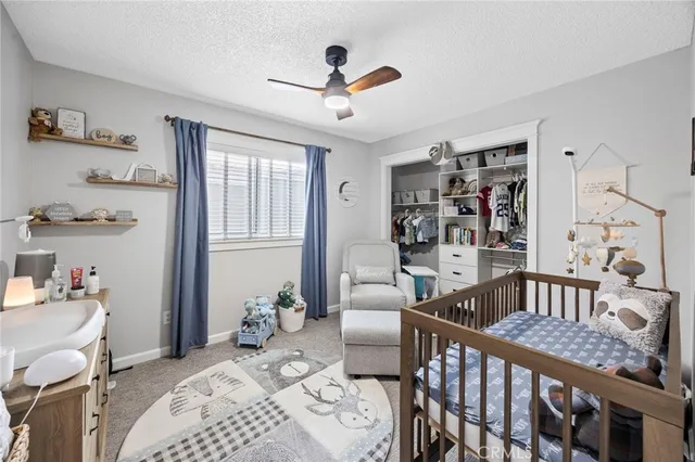 a bedroom with furniture and a window