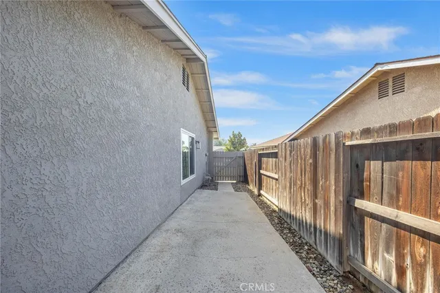 a view of a pathway of a house with wooden floor