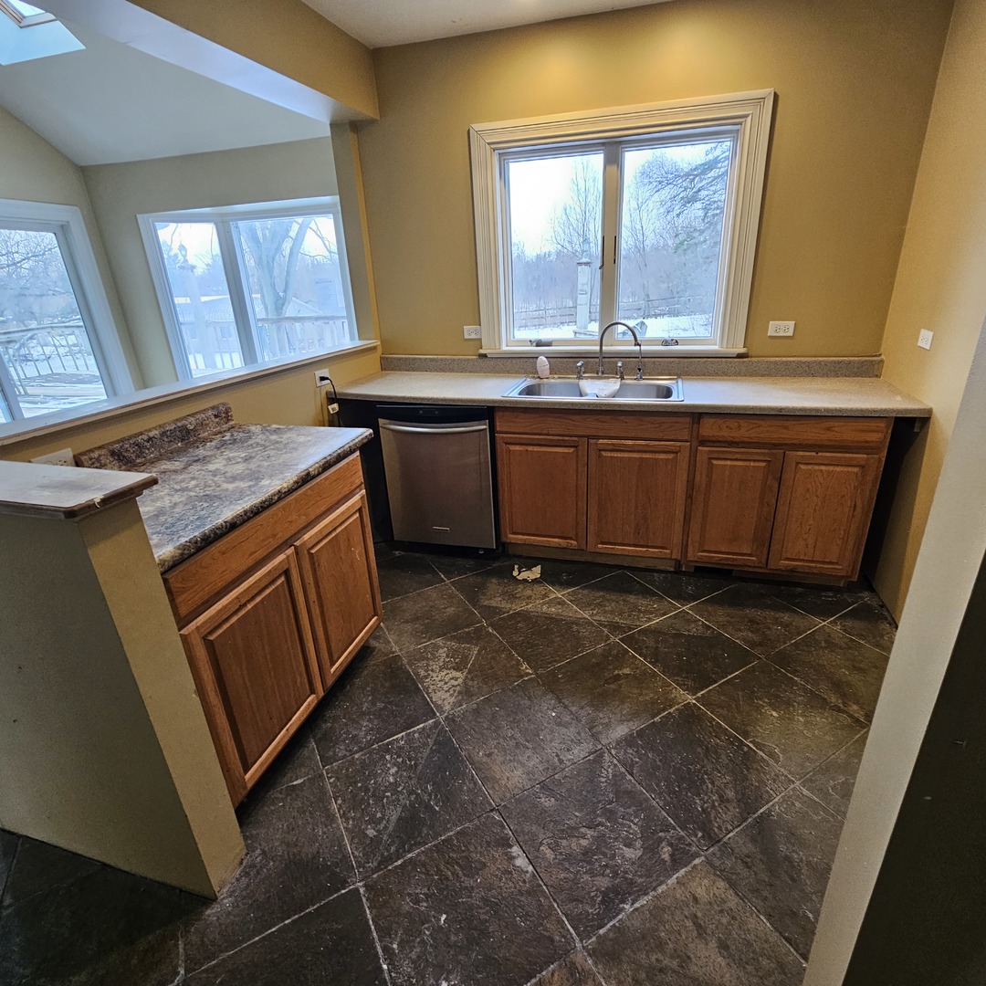 181 Old Sutton Road Barrington, IL 60010 - Photo 13 of 21 a view of a kitchen with a sink and a window