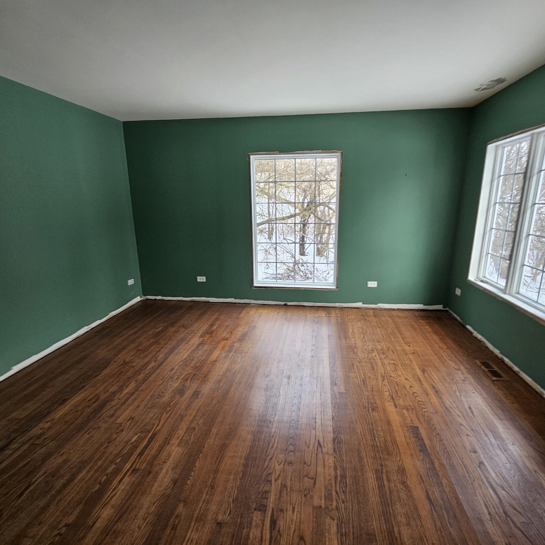 181 Old Sutton Road Barrington, IL 60010 - Photo 9 of 21 a view of room with window and wooden floor