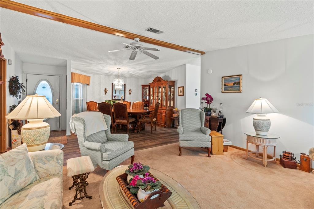 83 Eagle Circle Ellenton, FL 34222 - Photo 8 of 60 a living room with furniture and a lamp