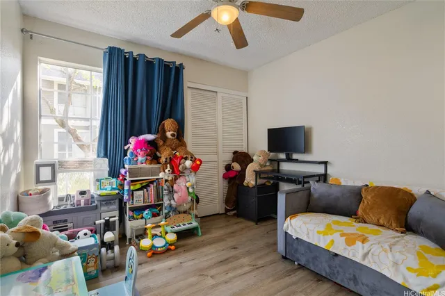 a living room with furniture and flowers