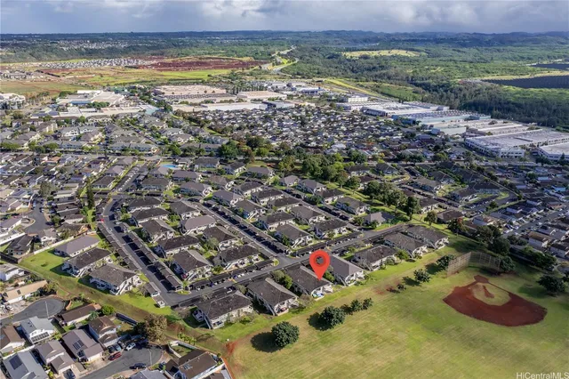an aerial view of residential building and lake