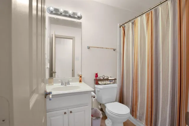 a front view of a house with patio and garden