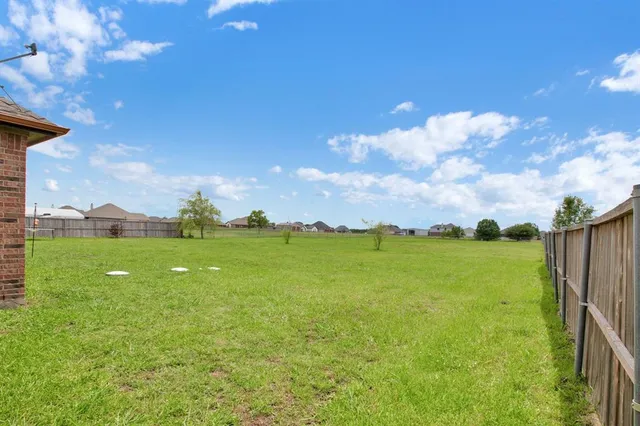 a view of an ocean with beach and outdoor space