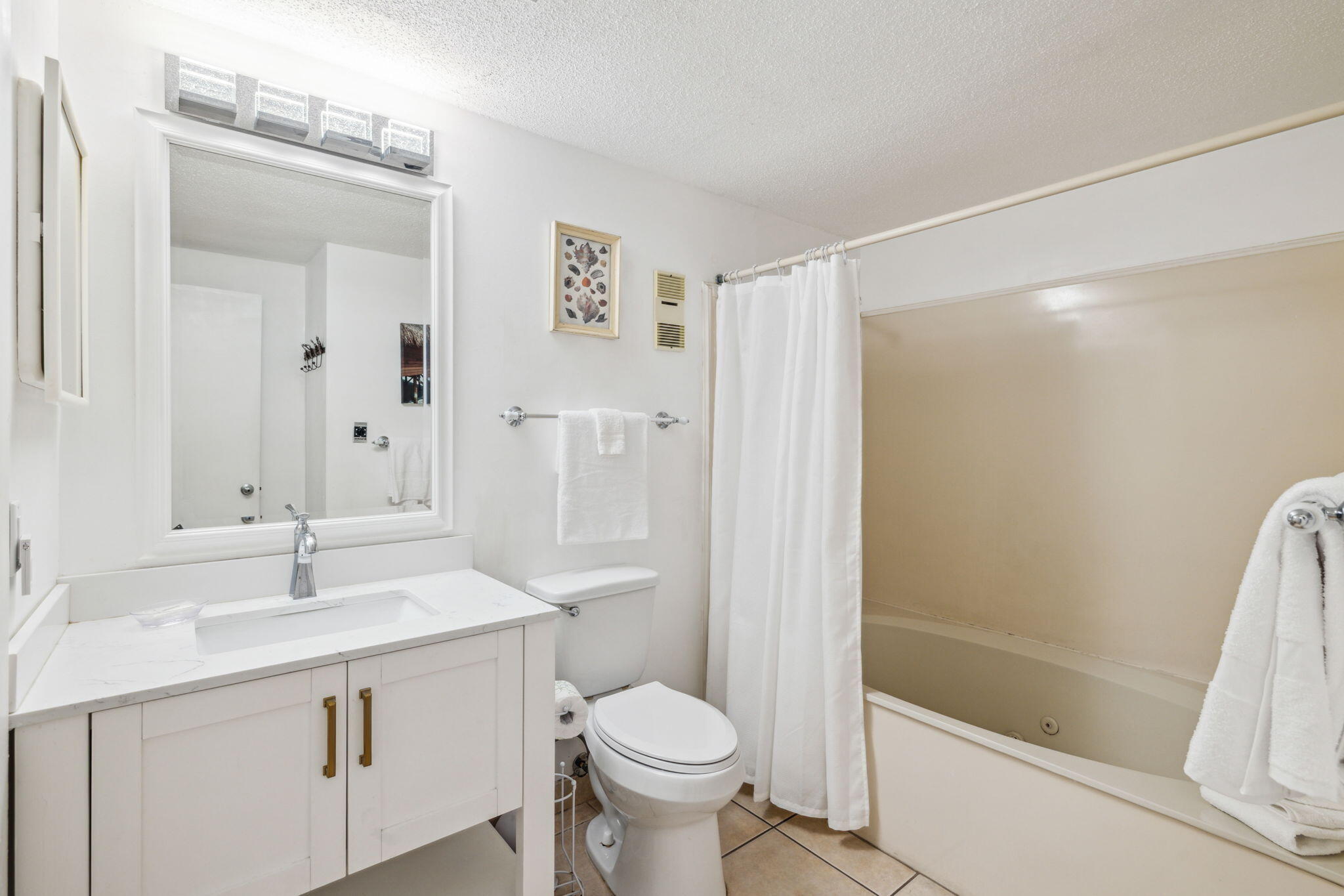 3722 East County Highway 30A, Unit 3 Santa Rosa Beach, FL 32459 - Photo 12 of 22 a bathroom with a sink a toilet and shower