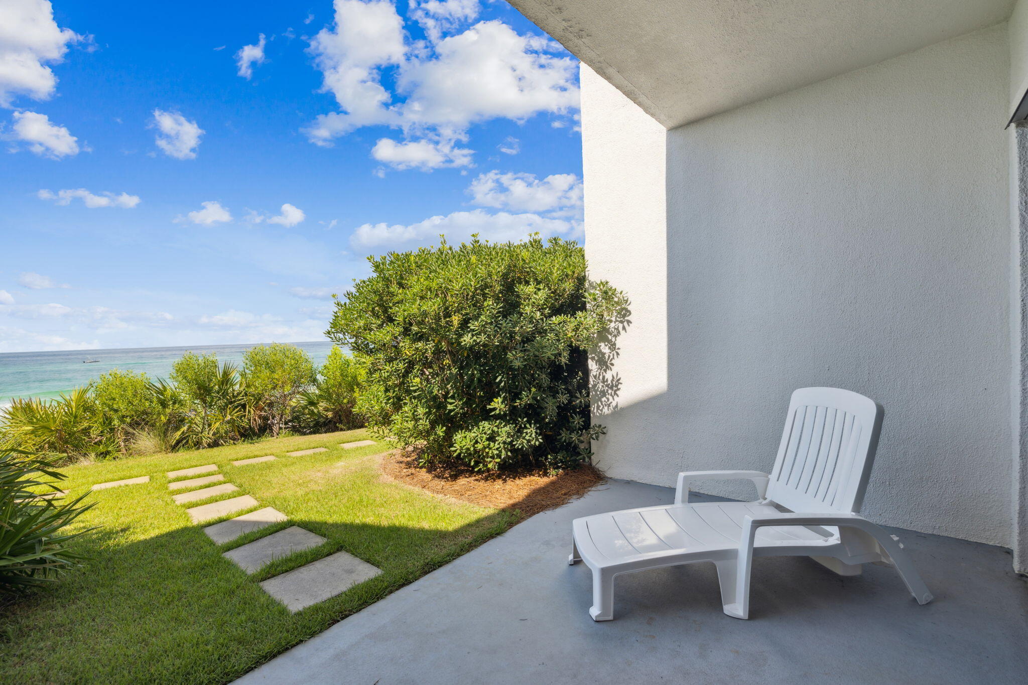 3722 East County Highway 30A, Unit 3 Santa Rosa Beach, FL 32459 - Photo 18 of 22 a view of chair and bench in backyard