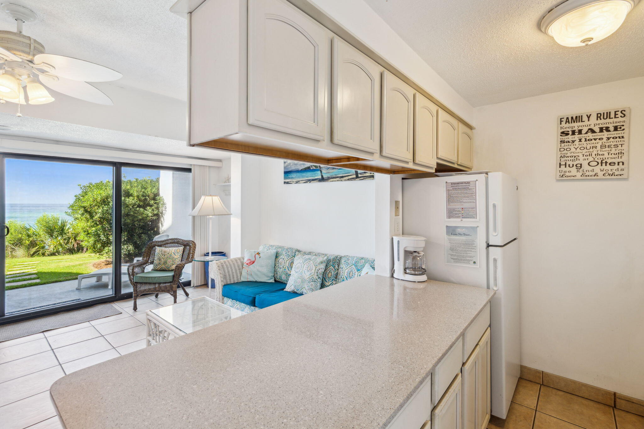 3722 East County Highway 30A, Unit 3 Santa Rosa Beach, FL 32459 - Photo 8 of 22 a kitchen with stainless steel appliances granite countertop a sink and a refrigerator