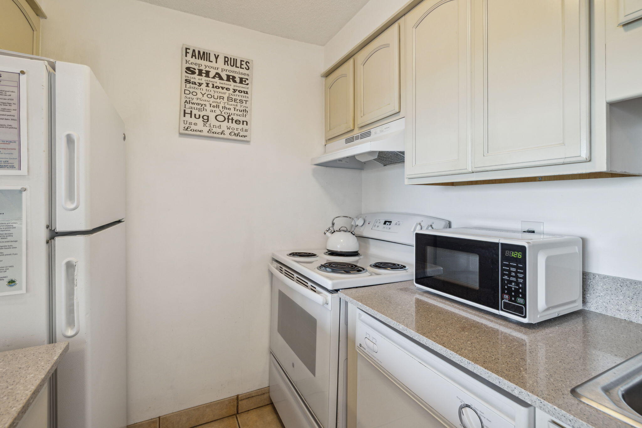 3722 East County Highway 30A, Unit 3 Santa Rosa Beach, FL 32459 - Photo 9 of 22 a kitchen with stainless steel appliances granite countertop a refrigerator and a stove