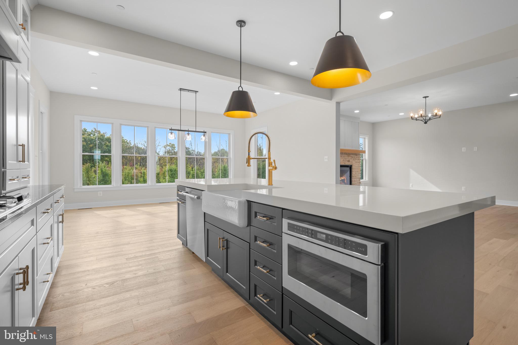 3683 Falling Grn Way Mount Airy, MD 21771 - Photo 23 of 50 a kitchen with stainless steel appliances granite countertop a stove a sink and a wooden cabinets