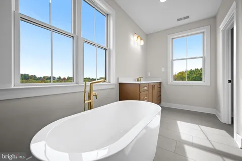 a living room with a window and furniture