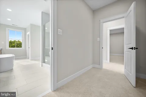 a view of a bathroom with a tub and shower