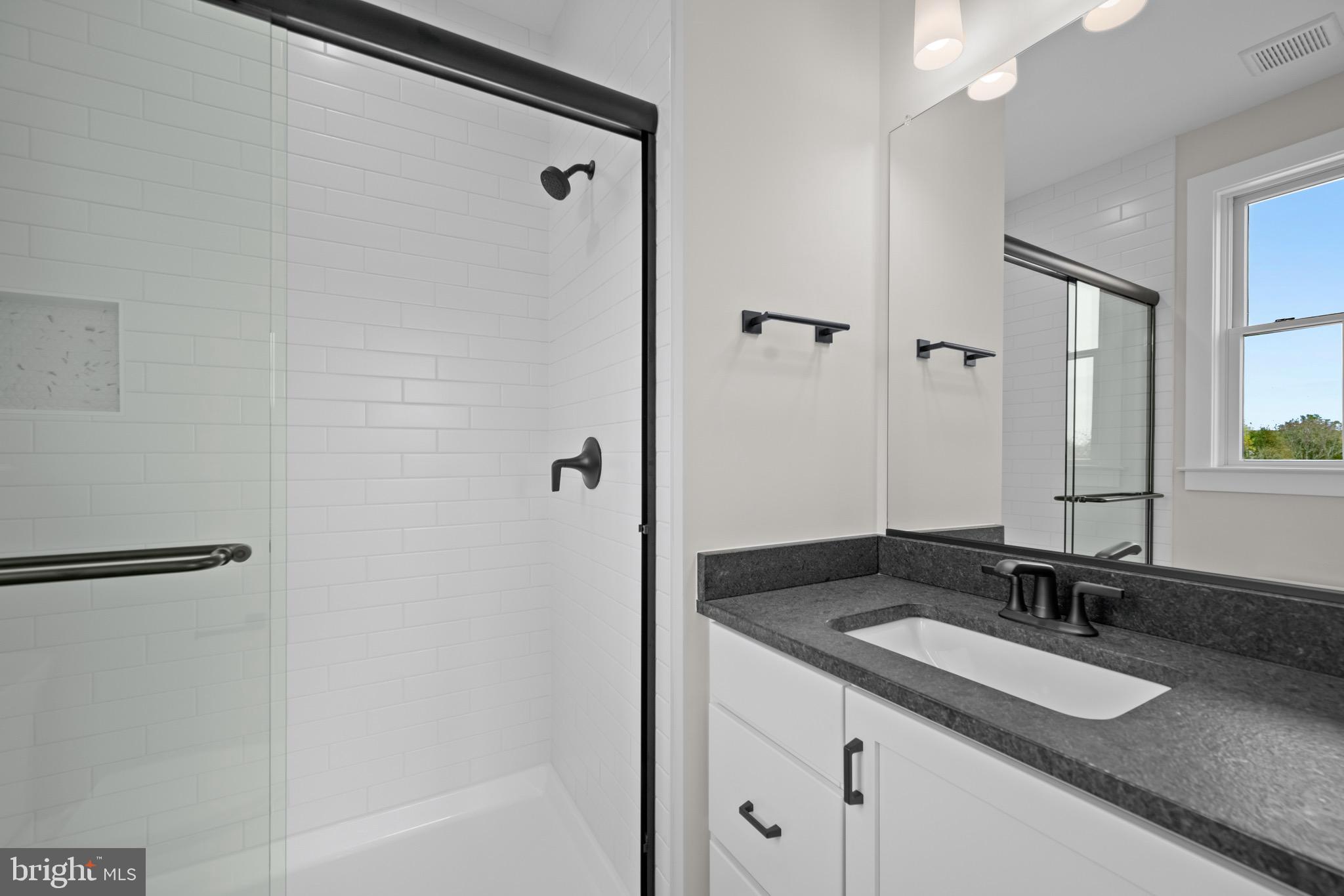 3683 Falling Grn Way Mount Airy, MD 21771 - Photo 40 of 50 a bathroom with a granite countertop sink and a mirror