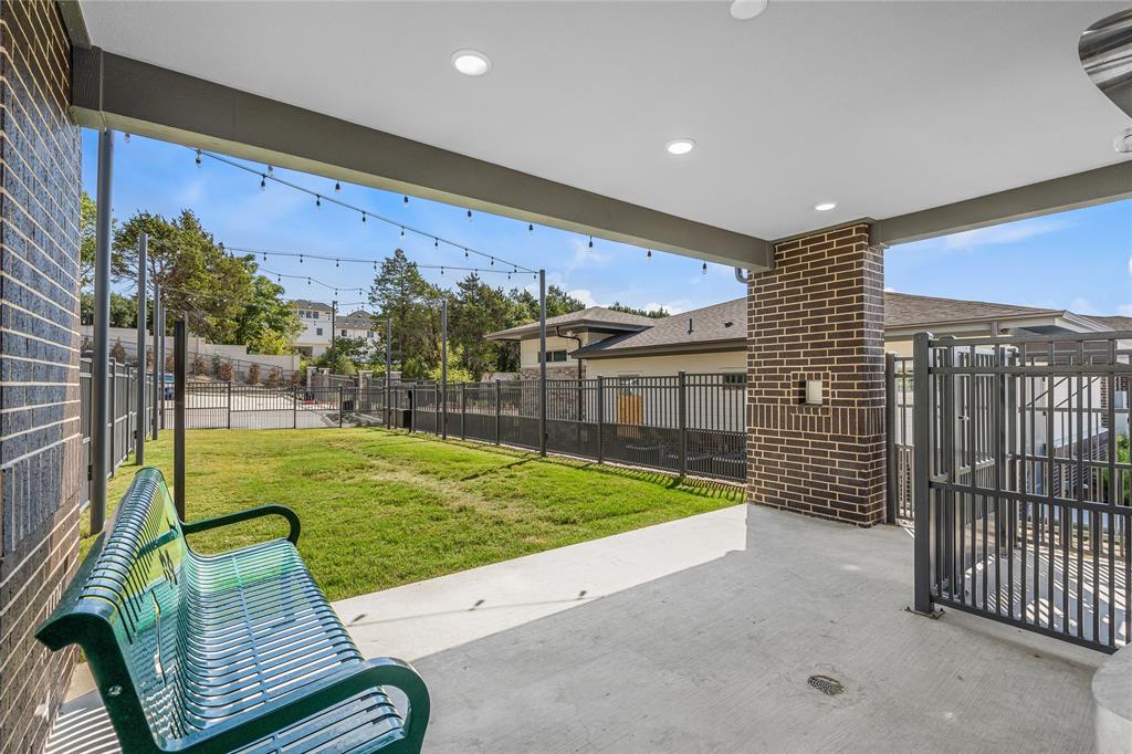 7455 West Camp Wisdom Road, Unit 5307 Dallas, TX 75236 - Photo 15 of 15 a view of a porch with furniture and garden