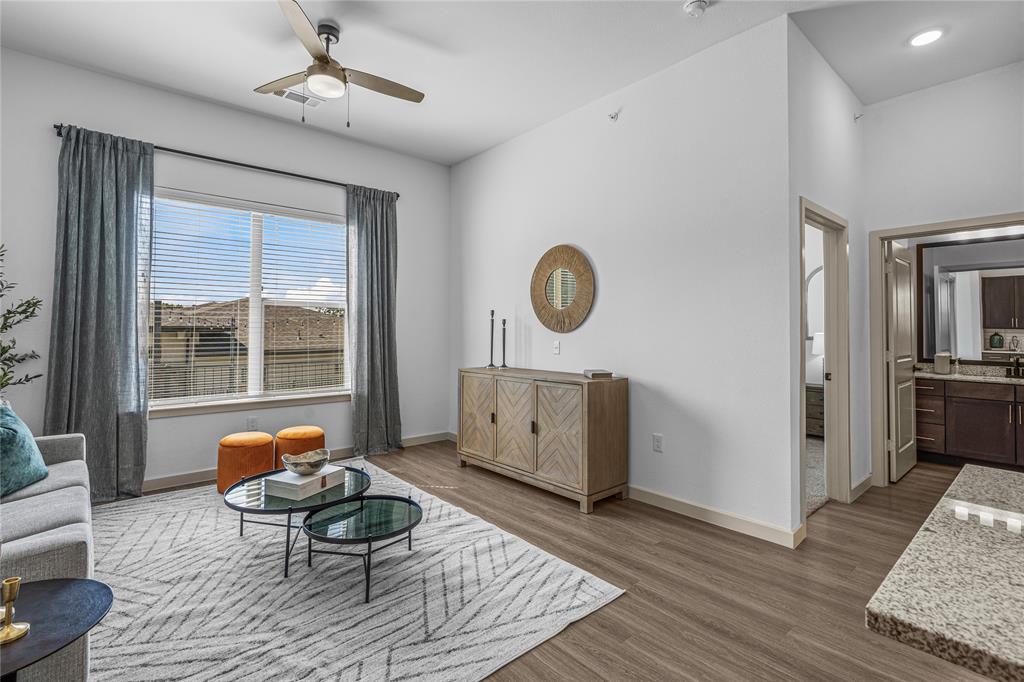 7455 West Camp Wisdom Road, Unit 5307 Dallas, TX 75236 - Photo 6 of 15 a living room with furniture and a window
