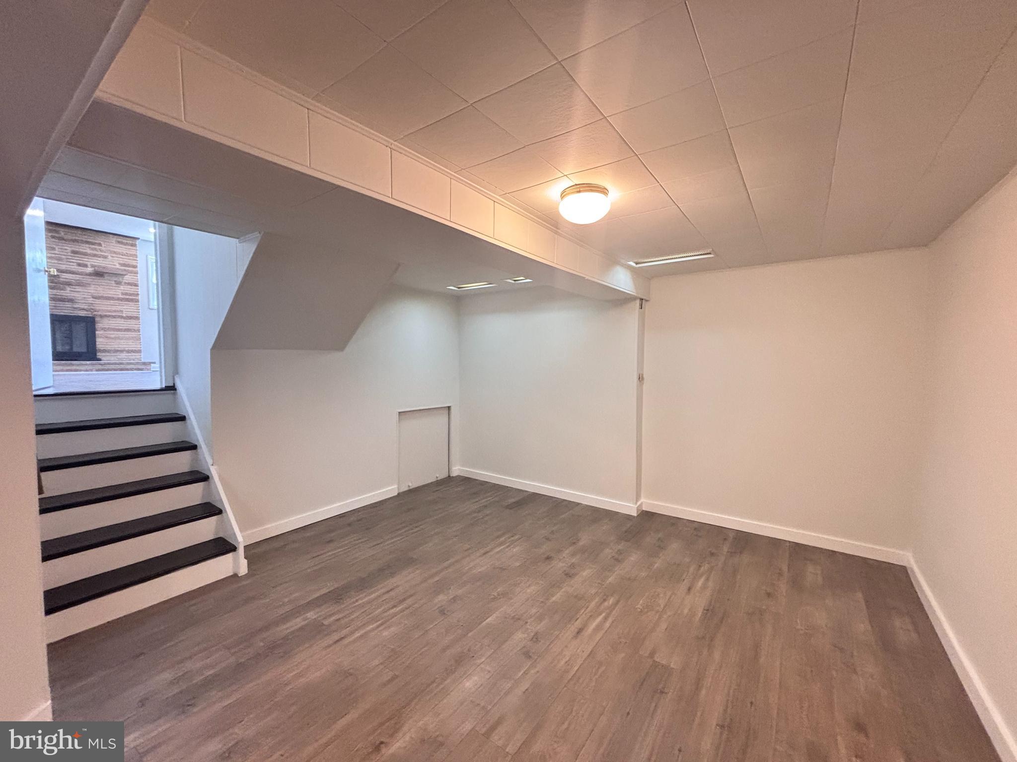 13015 Estelle Road Silver Spring, MD 20906 - Photo 33 of 38 wooden floor in an empty room with a window