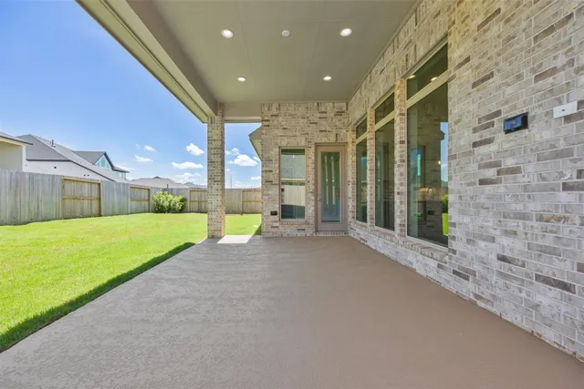 a view of a house with a backyard and a garden