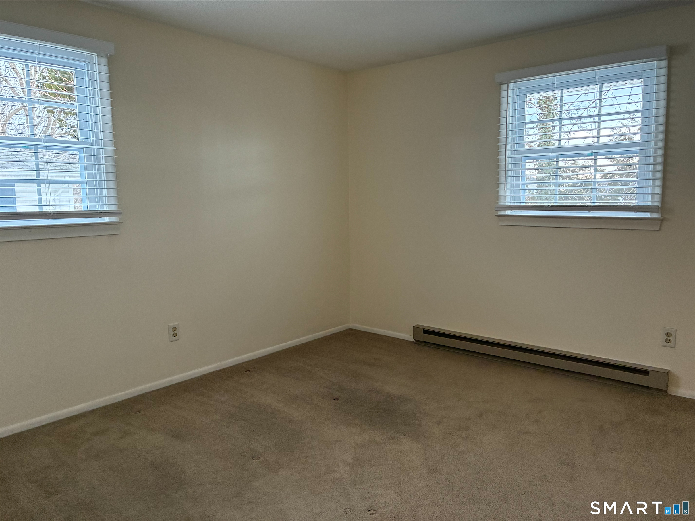 26 College Street, Unit 2 Clinton, CT 06413 - Photo 11 of 27 an empty room with windows