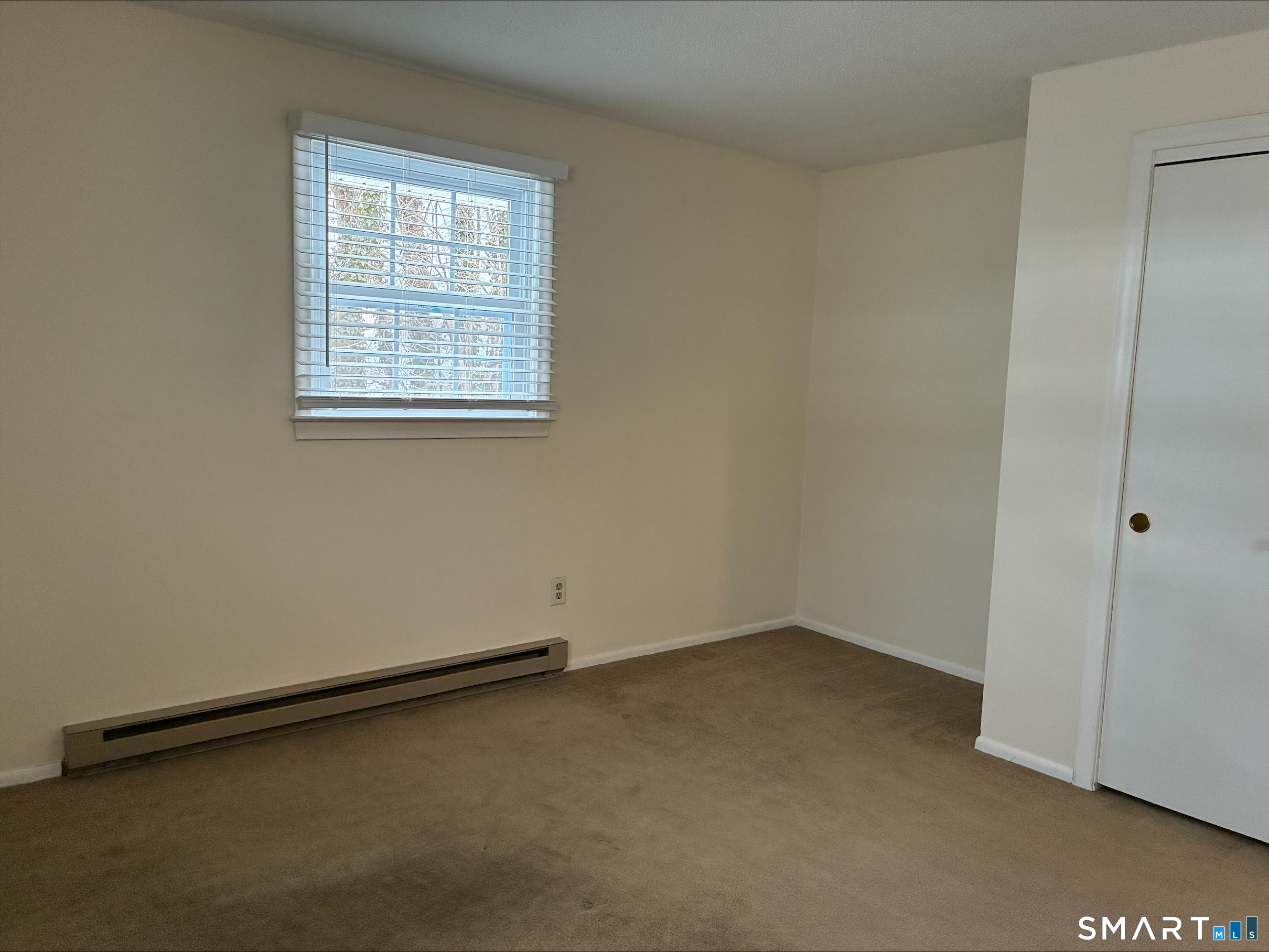 26 College Street, Unit 2 Clinton, CT 06413 - Photo 13 of 27 an empty room with a window