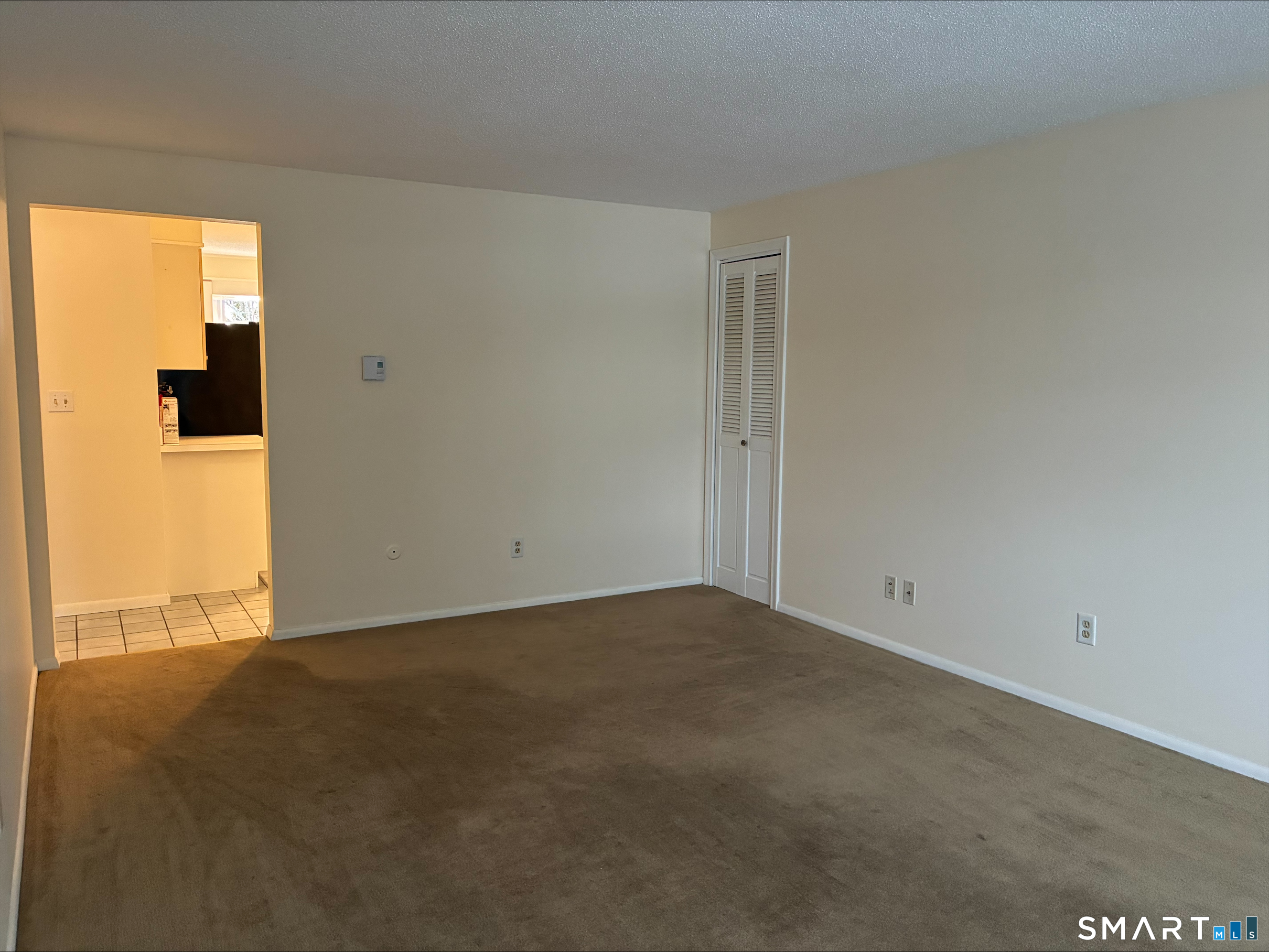 26 College Street, Unit 2 Clinton, CT 06413 - Photo 20 of 27 an empty room with windows