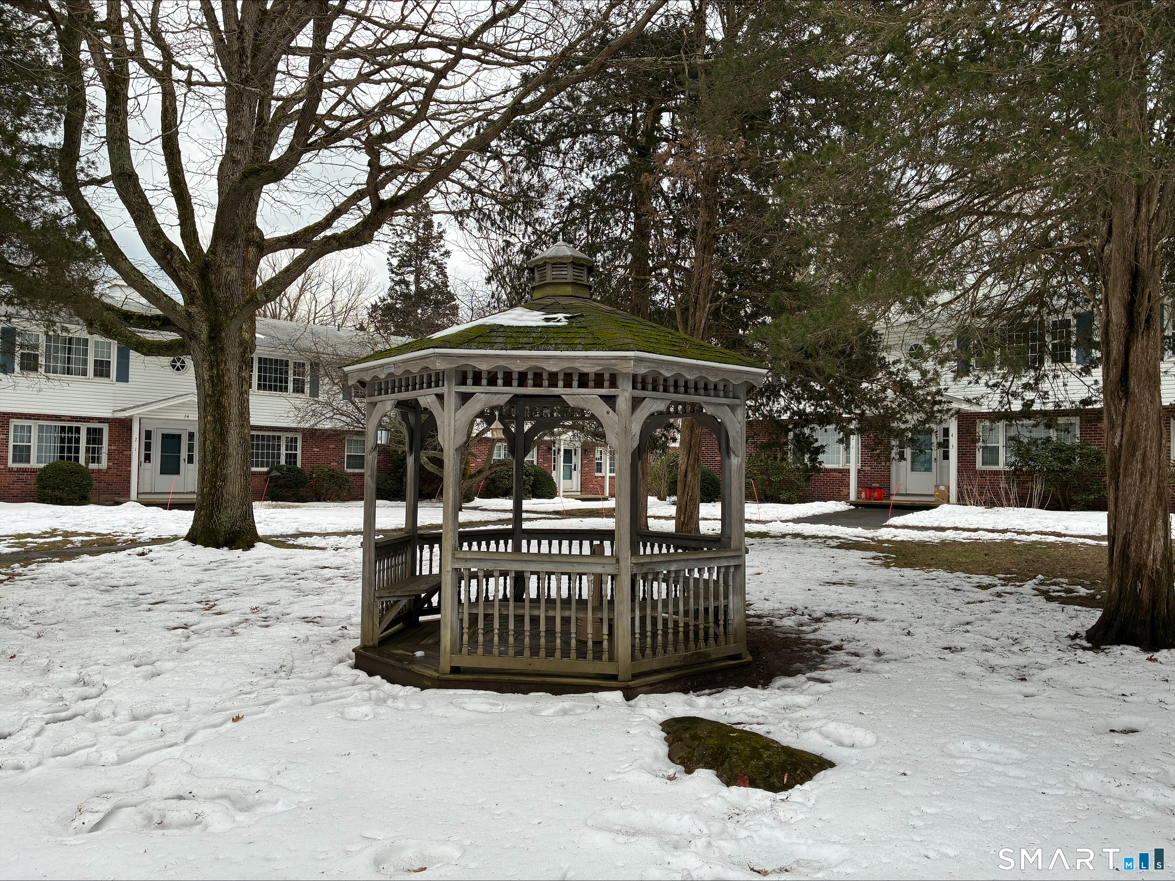 26 College Street, Unit 2 Clinton, CT 06413 - Photo 4 of 27 a view of street with sitting area and trees