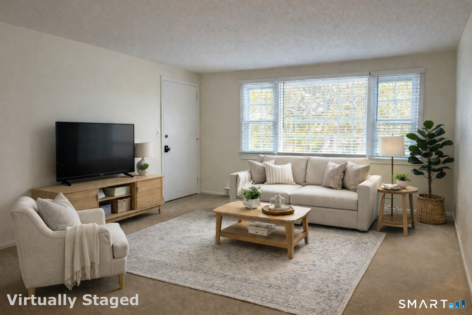 26 College Street, Unit 2 Clinton, CT 06413 - Photo 6 of 27 a living room with furniture and a flat screen tv