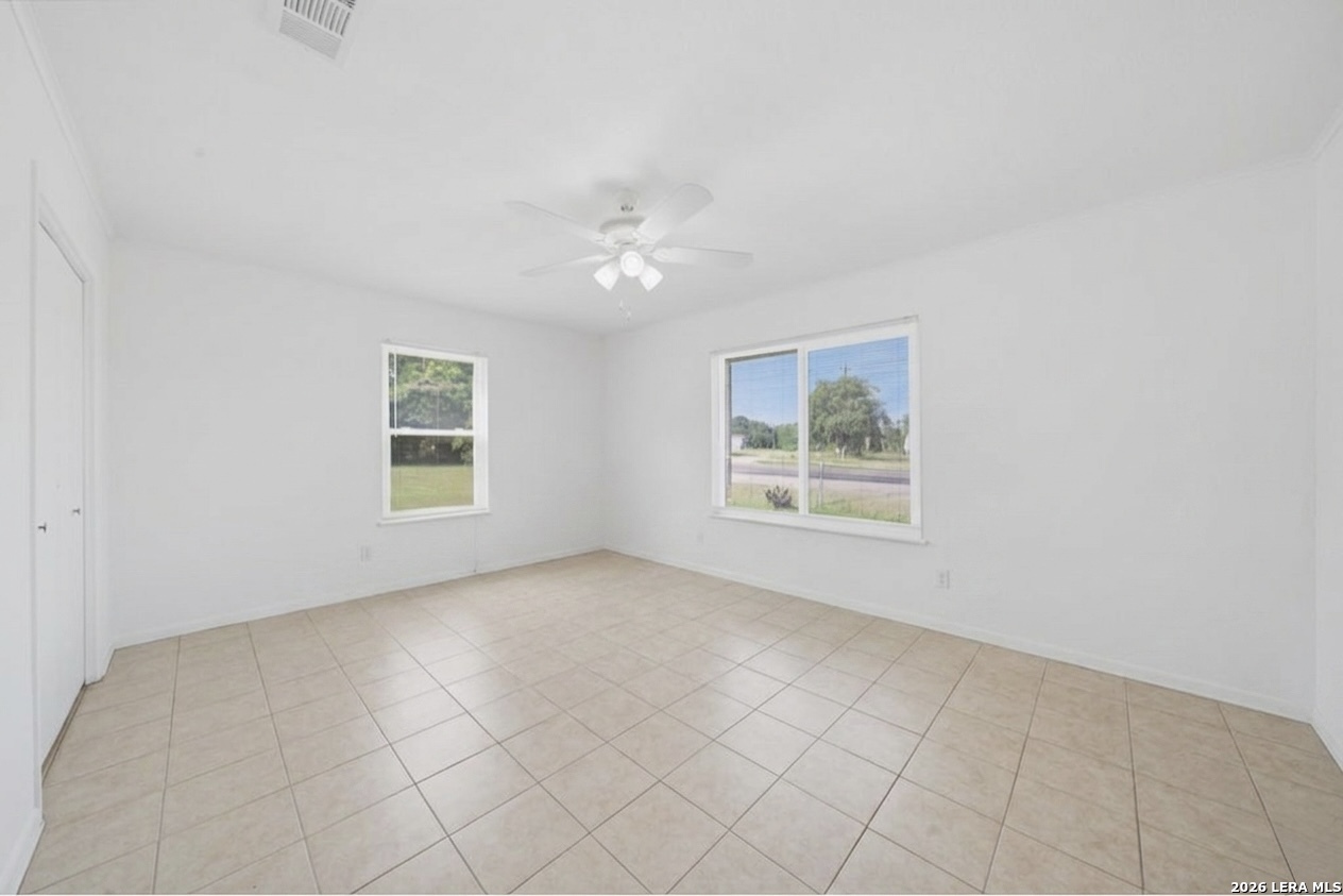 365 State Highway 95 Elgin, TX 78621 - Photo 20 of 34 an empty room with windows