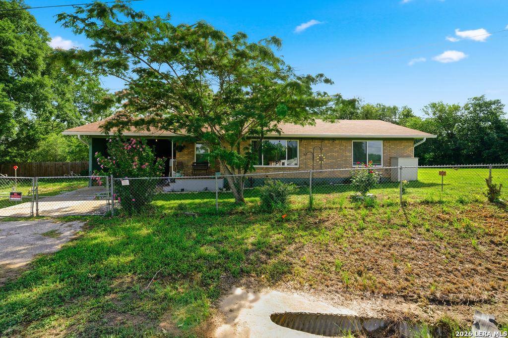 365 State Highway 95 Elgin, TX 78621 - Photo 2 of 34 a front view of a house with a yard