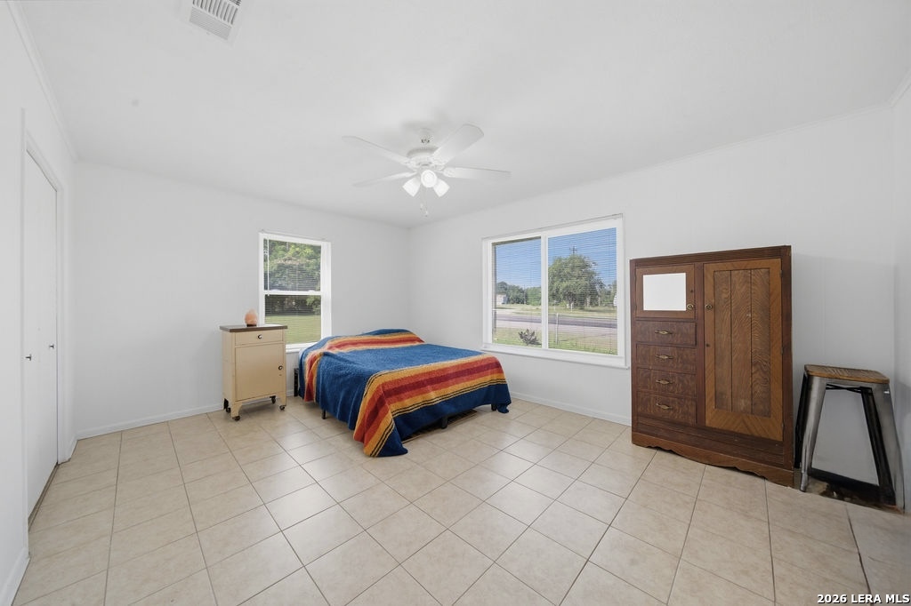 365 State Highway 95 Elgin, TX 78621 - Photo 21 of 34 a bedroom with a bed and a window