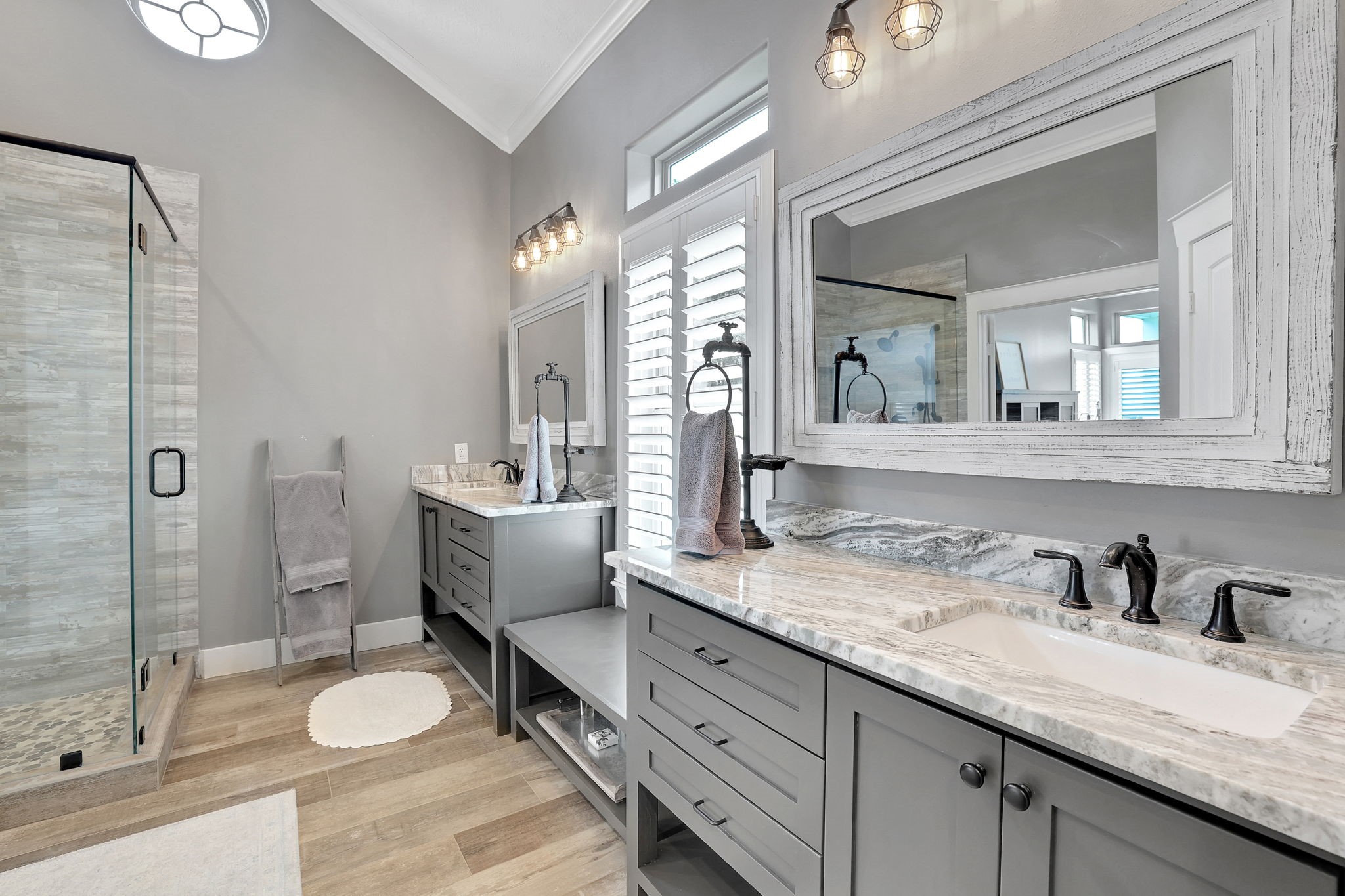 231 Ridge Cove Lane Coldspring, TX 77331 - Photo 20 of 50 The primary bathroom features high ceilings, dual sinks and a spacious walk in closet