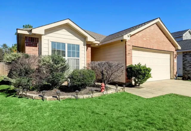a front view of a house with a yard and porch
