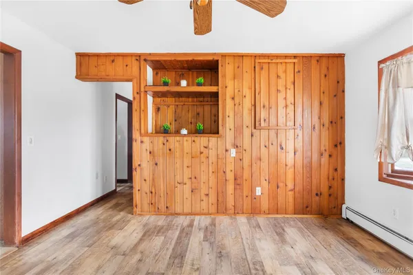 an entryway with wooden floor