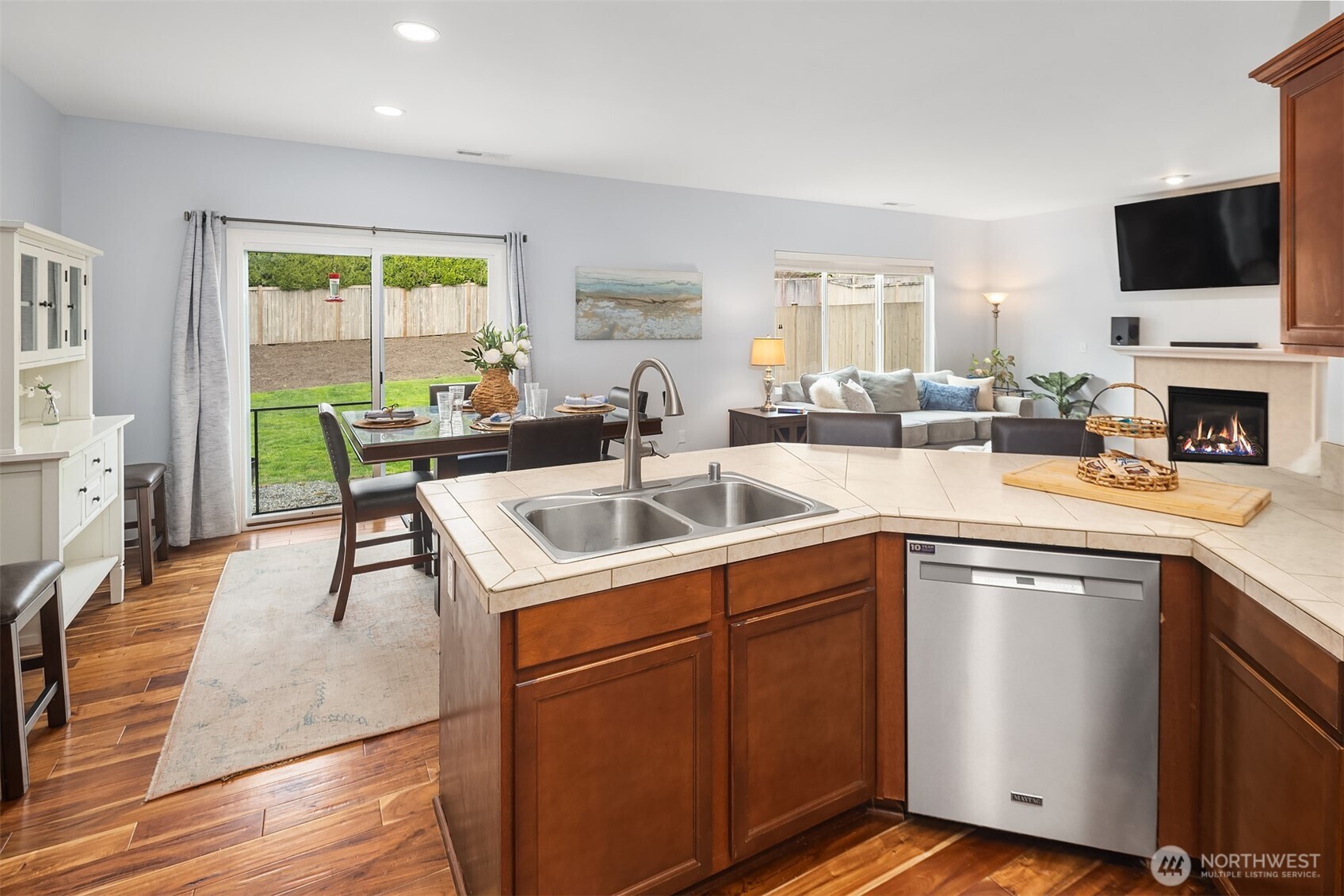 4119 167th Place Southeast Bothell, WA 98012 - Photo 12 of 39 a kitchen with a sink a counter top space and living room area
