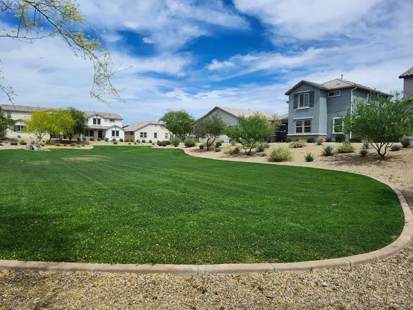a view of a house with a backyard porch and sitting area