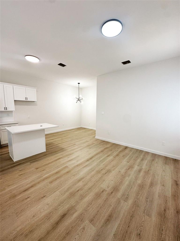 9705 Garcroft Street, Unit A Houston, TX 77029 - Photo 2 of 21 a view of a room with wooden floor and sink
