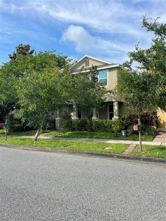 8624 Powder Ridge Trail Windermere, FL 34786 - Photo 1 of 1 a front view of a house with a yard and trees