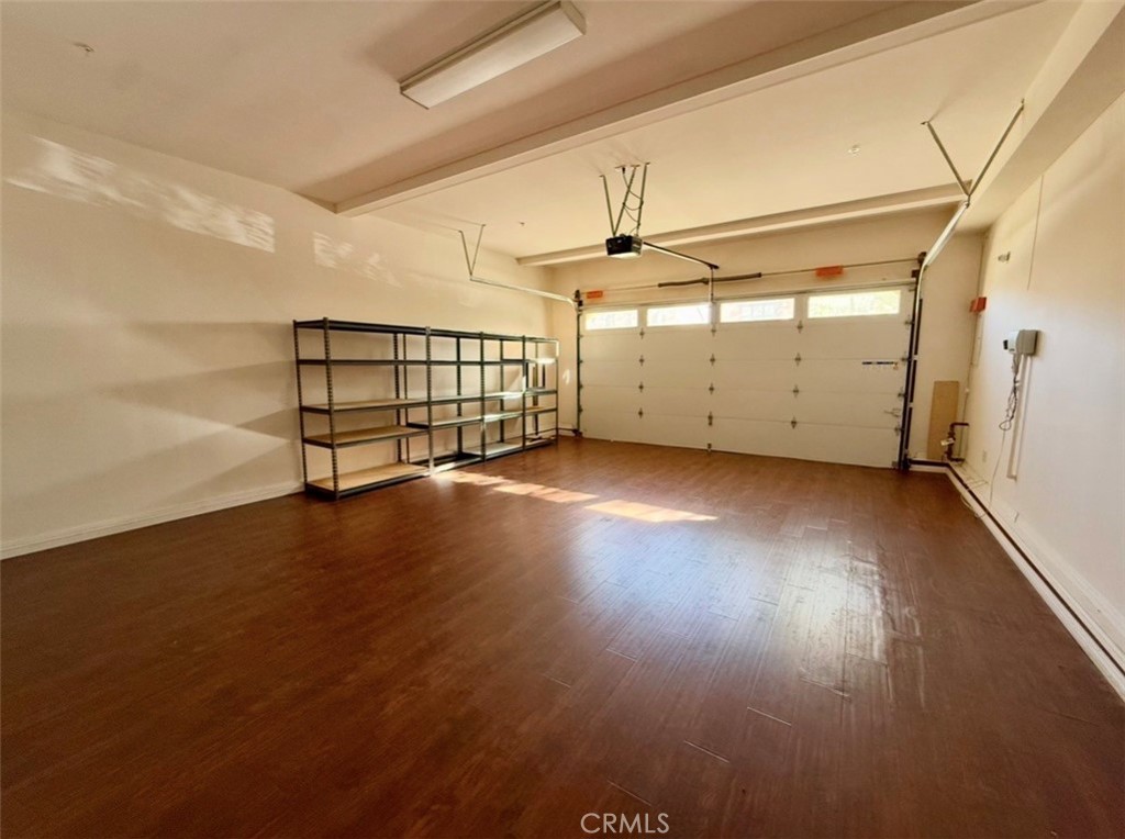 667 Desert Willow Road Azusa, CA 91702 - Photo 21 of 75 an empty room with wooden floor and windows