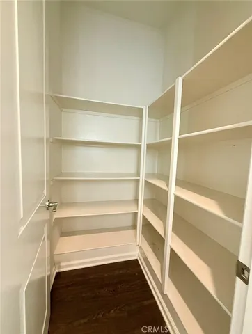 a large kitchen with stainless steel appliances granite countertop a lot of counter space and a sink